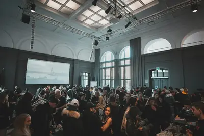 Crowd of professionals gathered in a large hall at a networking conference